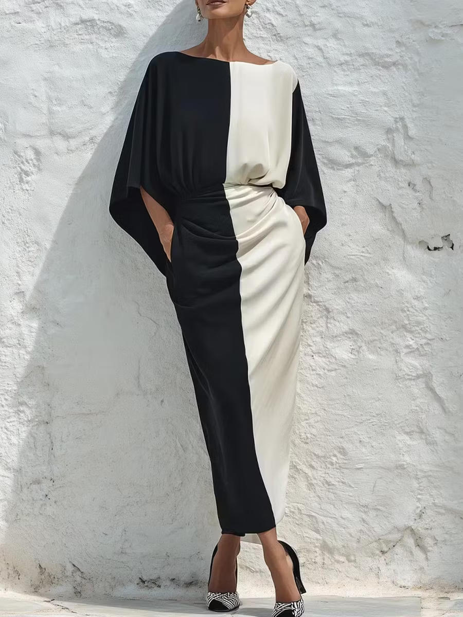 Two-piece set with a contrasting white and black top and midi skirt